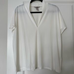 V Neck white shirt, never worn, can fit between XL and 2X comfortably